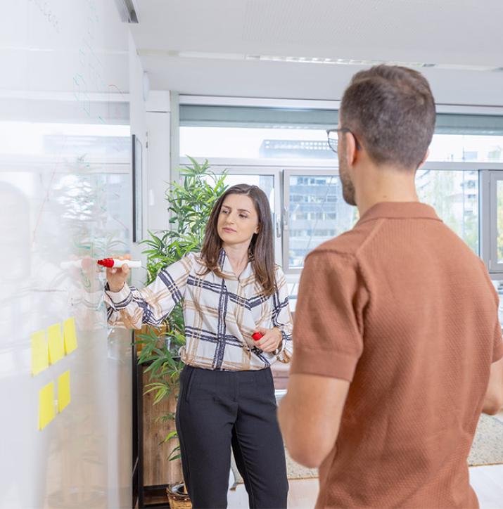 2 people analyzing business & product